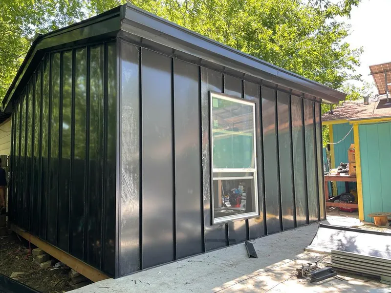 Black standing seam metal wall panels for Roof Inspection in Tea